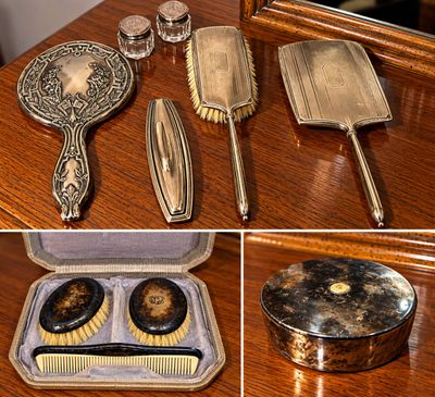 Sale Photo Thumbnail #16: Antique silver-plated vanity dresser set, including handheld mirrors, hairbrushes, glass cosmetic jars, and faux tortoiseshell accessories in a fitted travel case.
