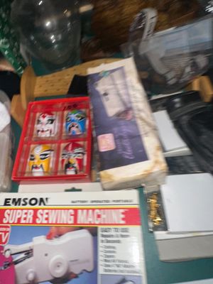 Sale Photo Thumbnail #37: Collection of vintage crafting supplies and novelties, including an Emson Super Sewing Machine boxed set and a boxed set of mini Chinese opera masks.