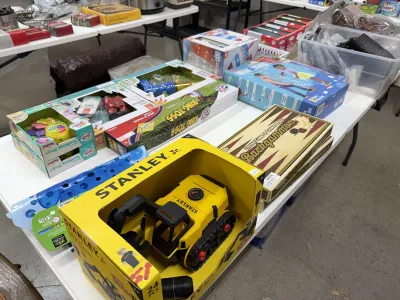 Sale Photo Thumbnail #9: Selection of boxed modern toys and games including a Stanley Jr. toy excavator, a Backgammon set, a Ring Toss game, and infant teething toys.