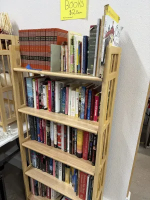Sale Photo Thumbnail #15: Large collection of assorted books, including hardcovers, paperbacks, dictionaries, and a multi-volume Childcraft encyclopedia set.