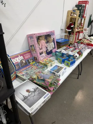 Sale Photo Thumbnail #21: Collection of vintage toys and board games, including boxed dolls, jigsaw puzzles, and Parker Brothers Monopoly.