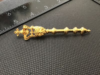 Sale Photo Thumbnail #62: A gold-tone costume jewelry brooch in the design of a royal scepter topped with a crowned cross. Features detailed textured metalwork and a standard rollover safety clasp on the reverse. Measures approximately 2.5 inches long. In good vintage condition wi