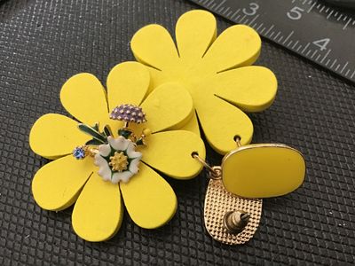Sale Photo Thumbnail #186: Pair of bold yellow statement drop earrings featuring daisy-style flower shapes decorated with central enamelled floral, mushroom, and rhinestone accents. Fitted with post backs. Measure approximately 2.5 inches long. Excellent pre-owned condition with no