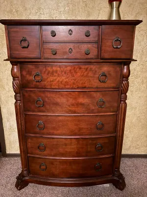 Sale Photo Thumbnail #6: Traditional dark cherry highboy chest of drawers featuring ornate antique brass hardware, twisted side column accents, and carved paw feet.