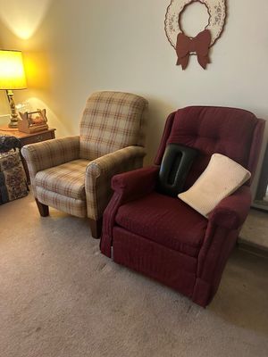 Sale Photo Thumbnail #29: Pair of vintage upholstered armchairs, including a beige plaid recliner and a burgundy wingback-style chair with support cushions.