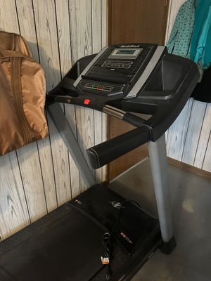 Sale Photo Thumbnail #54: NordicTrack T 6.1 treadmill featuring a 2.6 CHP motor, digital display console, and integrated cup holders.