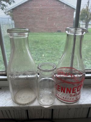 Sale Photo Thumbnail #57: Set of three vintage glass milk bottles from Huntington, West Virginia dairies, including Huntington Creamery Co. and Kennedy Dairy, in various sizes.
