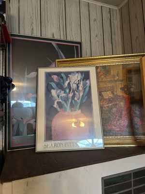 Sale Photo Thumbnail #52: Collection of framed artwork, including a Sharon Pitts floral watercolor exhibition poster and an ornate gold-framed interior scene print.