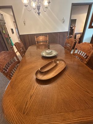 Sale Photo Thumbnail #63: Traditional oak dining table with parquet pattern top and six carved press-back chairs.
