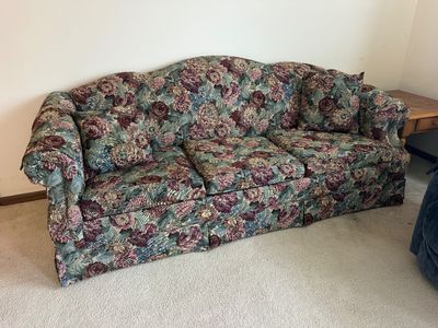 Sale Photo Thumbnail #15: Traditional 1990s camelback sofa upholstered in a tapestry floral fabric in shades of burgundy, green, and cream, featuring matching throw pillows.