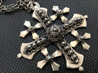 Sale Photo Thumbnail #33: Ornate silver-tone Jerusalem cross pendant necklace featuring intricate filigree work and beaded embellishments. The pendant measures approximately 2.5 inches by 2.5 inches and comes attached to a heavy textured link chain with a spring ring clasp. The re