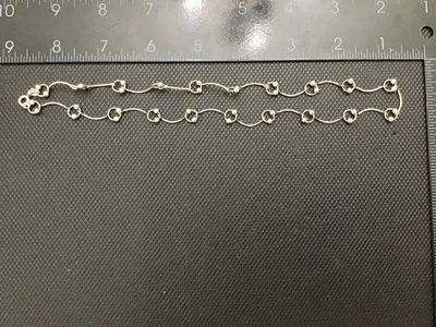 Sale Photo Thumbnail #96: A sterling silver link chain necklace featuring curved bar links accented with small bead charms. Stamped 925 near the spring ring clasp. Measures approximately 18 inches in total length when laid end to end. In good pre-owned condition with light tarnish