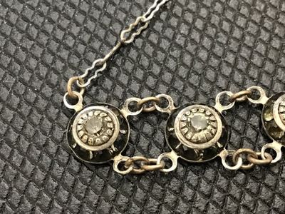 Sale Photo Thumbnail #73: Vintage Art Deco style choker necklace featuring linked circular stations set with bezel-set rhinestones or crystal accents, detailed textured backs, and a spring ring clasp with a faceted bead extension charm. Measures approximately 14-16 inches long. Sh