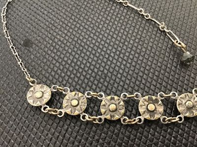 Sale Photo Thumbnail #75: Vintage Art Deco style choker necklace featuring linked circular stations set with bezel-set rhinestones or crystal accents, detailed textured backs, and a spring ring clasp with a faceted bead extension charm. Measures approximately 14-16 inches long. Sh