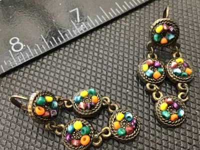 Sale Photo Thumbnail #141: Pair of vintage-style drop/dangle earrings featuring colorful glass micro mosaic or seed bead detail in antiqued brass-tone round settings. Each earring measures approximately 2 inches long. Designed with secure leverback closures. Pre-owned condition wit