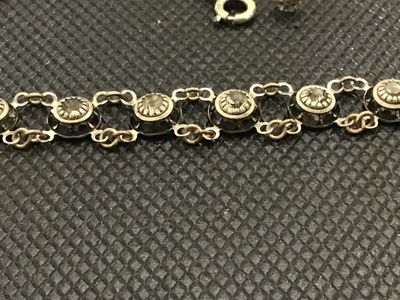 Sale Photo Thumbnail #74: Vintage Art Deco style choker necklace featuring linked circular stations set with bezel-set rhinestones or crystal accents, detailed textured backs, and a spring ring clasp with a faceted bead extension charm. Measures approximately 14-16 inches long. Sh