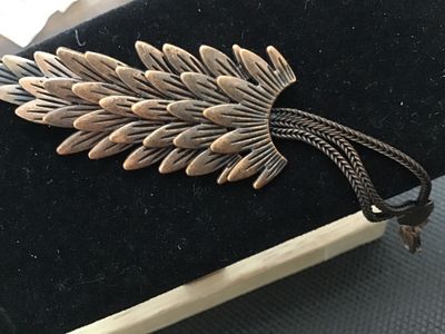Sale Photo Thumbnail #109: Fashion costume bracelet featuring a multi-layered feather or scale centerpiece in a antique copper-tone finish. Attached to multi-strand wheat chain with a lobster claw clasp and adjustable extension chain. Good condition with light wear consistent with 