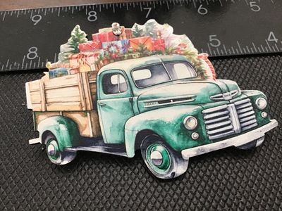 Sale Photo Thumbnail #117: Wooden brooch pin featuring a printed watercolor-style graphic of a green vintage pickup truck loaded with Christmas gifts, a tree, and holiday decor. Decorated with a small rhinestone accent at the top. Measures approximately 3 inches wide. Good pre-owne