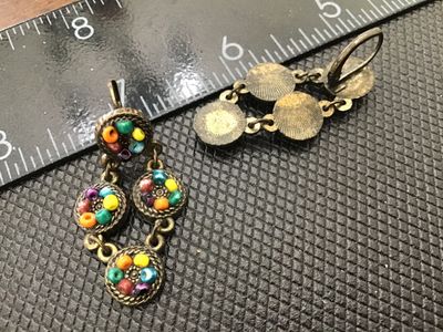 Sale Photo Thumbnail #142: Pair of vintage-style drop/dangle earrings featuring colorful glass micro mosaic or seed bead detail in antiqued brass-tone round settings. Each earring measures approximately 2 inches long. Designed with secure leverback closures. Pre-owned condition wit