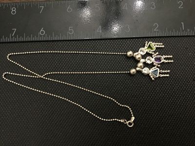 Sale Photo Thumbnail #70: Sterling silver ball chain necklace featuring three charming stick-figure girl pendants, each set with a clear top stone and colored gemstone bodies (blue, purple, and green). Stamped 925 on the chain clasp and pendant bails. 
925 Pendants 
- Material: St