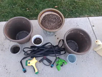 Sale Photo Thumbnail #111: ASSORTED GARDEN PLANTERS AND POTS, EXPANDABLE HOSE, MIRACLE-GRO SPRAY NOZZLE, SPRAY ATTACHMENTS, AND SPRINKLER HEAD.