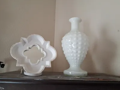 Sale Photo Thumbnail #420: WHITE MILK GLASS HOBNAIL VASE AND A MATCHING WHITE CERAMIC/RESIN QUATREFOIL MIRRORED TRAY DISH WITH METAL DISPLAY STAND AND MORE. BOTH PIECES IN GOOD CONDITION WITH NO VISIBLE CHIPS OR CRACKS.