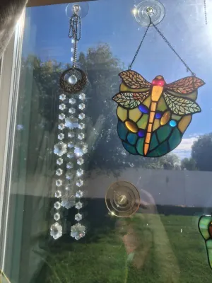 Sale Photo Thumbnail #371: LOT INCLUDES STAINED GLASS DRAGONFLY SUN CATCHER AND CRYSTAL PRISM WINDOW HANGING CHIME. GOOD CONDITION AND MORE.