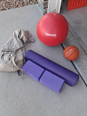 Sale Photo Thumbnail #200: REEBOK EXERCISE BALL, NIKE MINI BASKETBALL, EVOLAND UNDER DESK PEDAL EXERCISER, PURPLE YOGA MAT, TWO FOAM BLOCKS, CANVAS CARRY BAG, AND MORE. ALL ITEMS SHOW LIGHT SIGNS OF USE.
