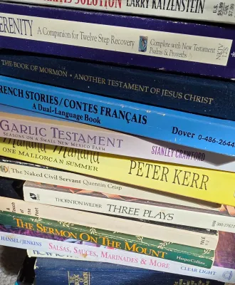 Sale Photo Thumbnail #41: Stack of assorted vintage and contemporary paperback books including religious texts, literature, and cookbooks.