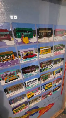 Sale Photo Thumbnail #47: Framed pop art print titled '300 Seconds at the West Beach Cafe', featuring a colorful grid illustration of streetscapes and vehicles.