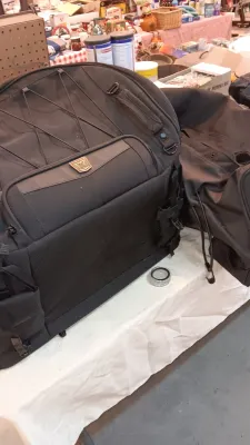 Sale Photo Thumbnail #22: Large Kuryakyn black nylon motorcycle luggage bag with multiple zippered pockets and attachment straps.