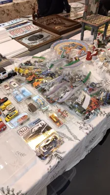 Sale Photo Thumbnail #52: Large collection of vintage and modern die-cast toy cars, including loose vehicles in plastic bags, blister-packed Auto World models, and small plastic display cases.