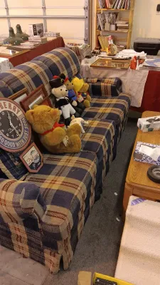 Sale Photo Thumbnail #56: Plaid upholstered sofa displayed with vintage teddy bears, a novelty clock, and various household collectibles.