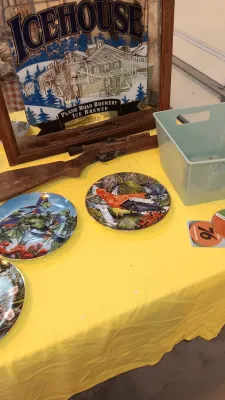 Sale Photo Thumbnail #25: Vintage Icehouse Plank Road Brewery mirror sign alongside bird-themed decorative plates and a novelty wooden gun prop.