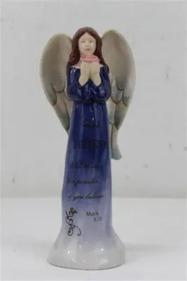 Glazed ceramic angel figurine in a blue gown, featuring an inspirational script from Mark 9:23 and holding a pink flower.