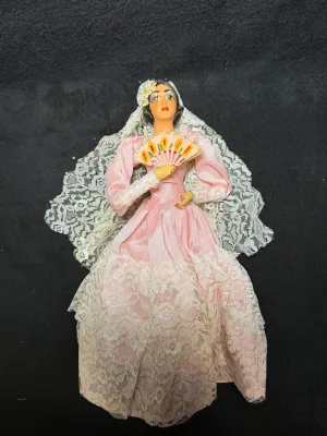 Vintage Spanish souvenir doll in a pink satin gown with lace trim, mantilla veil, and hand fan.
