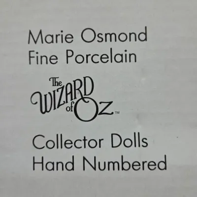 Packaging label for a Marie Osmond Fine Porcelain Wizard of Oz hand-numbered collector doll.