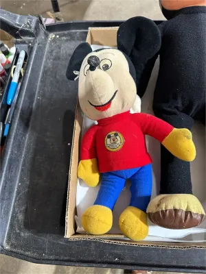 Vintage Mickey Mouse Club plush doll wearing a red sweater with blue pants and yellow boots, showing light age-related wear.
