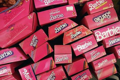 Collection of vintage 1980s and 1990s Mattel Barbie doll boxes in iconic pink packaging, including various special editions.