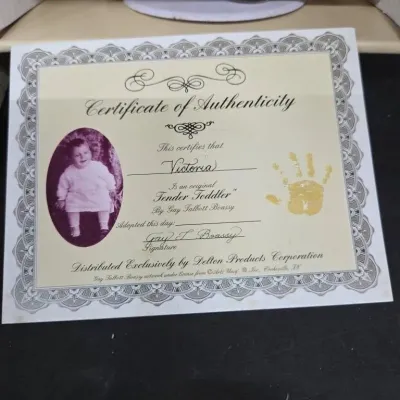 Certificate of Authenticity for a Gay Talbott Boassy 'Tender Toddler' doll named Victoria, distributed by Delton Products...