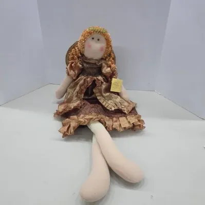 Handcrafted rag doll angel featuring curly brown hair, a metallic bronze dress with ruffled trim, and long soft legs.
