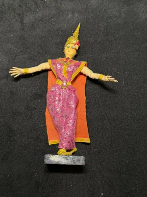 Vintage Thai or Balinese dancer souvenir doll depicting a performer in traditional metallic pink and gold costume with an ornate...