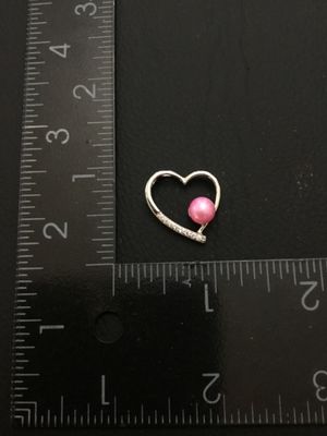 Sale Photo Thumbnail #11: A silver-tone open heart charm or pendant featuring a pink faux-pearl accent and small clear rhinestone accents along one side. Measures approximately 3/4 inch wide by 3/4 inch high. Good pre-owned condition with light wear.