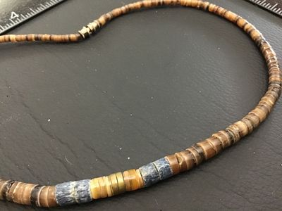Sale Photo Thumbnail #224: A vintage-style Native American Southwestern-inspired beaded necklace featuring sliced heishe shell disc beads and accent stone beads. The necklace features a barrel screw clasp. Good pre-owned condition with natural variations in the shell and stone bead