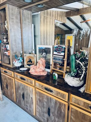 Southwestern decor items and a clay sculpture.