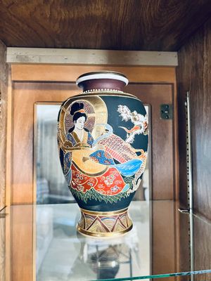 Vintage Japanese Satsuma-style porcelain vase featuring raised hand-painted imagery of a geisha, a dragon, and gold gilt accents on a...