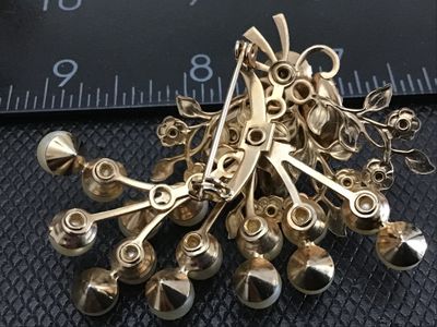 Sale Photo Thumbnail #20: Vintage gold-tone brooch pin featuring faux pearl clusters, textured molded cabochons, and shimmering aurora borealis (AB) rhinestones in a stylized floral spray design. Standard rollover safety clasp on the back. Measures approximately 2.5 inches wide. G