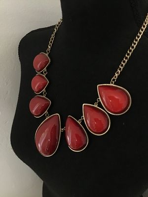 Sale Photo Thumbnail #116: Gold-tone fashion statement necklace featuring bold red teardrop cabochons set in polished gold-tone metal frames. Includes an adjustable curb chain with a lobster claw clasp and extender chain. In good pre-owned condition with no major visible flaws.