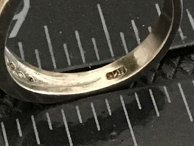 Sale Photo Thumbnail #66: Sterling silver band ring featuring a pavé-set top face with rows of blue and clear rhinestones/cz stones. Stamped 925 on the interior band. Measures approximately ring size 6 on a ring mandrel. Shows light surface wear and minor tarnishing consistent wi