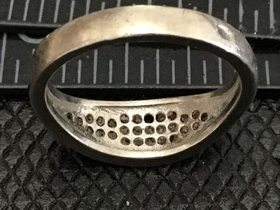 Sale Photo Thumbnail #65: Sterling silver band ring featuring a pavé-set top face with rows of blue and clear rhinestones/cz stones. Stamped 925 on the interior band. Measures approximately ring size 6 on a ring mandrel. Shows light surface wear and minor tarnishing consistent wi